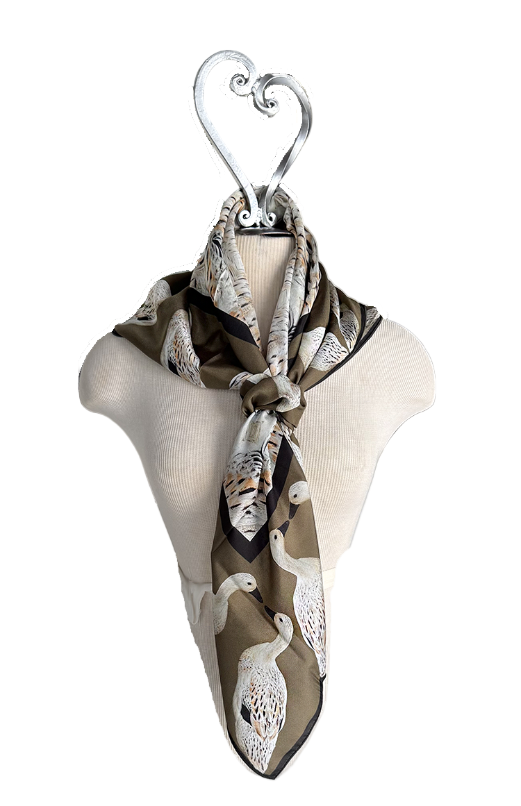 Scarf with duck pattern on a mannequin with a white background